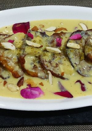 A picture of Sweet potato malpua with rabri.