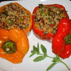 A picture of Stuffed peppers with three colors quinoawalnuts and raisins.