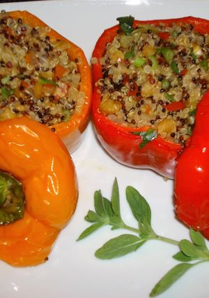 A picture of Stuffed peppers with three colors quinoawalnuts and raisins.