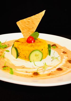 A picture of Khichdi with Achari Raita.