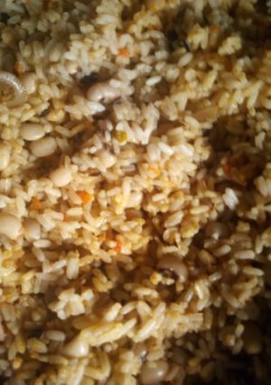 A picture of Jollof rice and pomo.