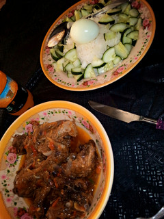 A picture of White Rice and Chicken Sauce.