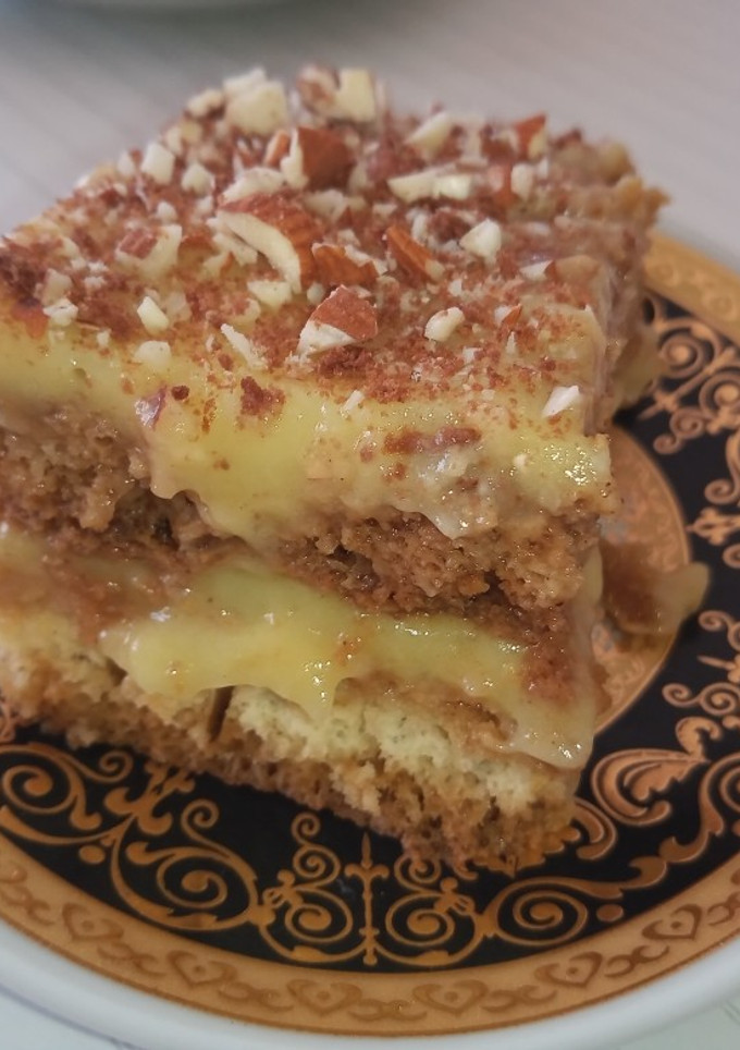 Una foto de Postre húmedo de café, vainillas y crema pastelera!!!🥧