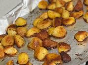 A picture of roasted potatoes with rosemary
