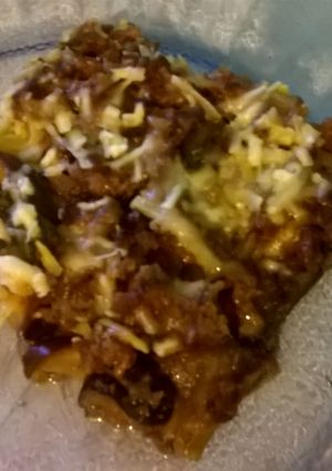 Una foto de Berengenas a la Parmesana con Boloñesa