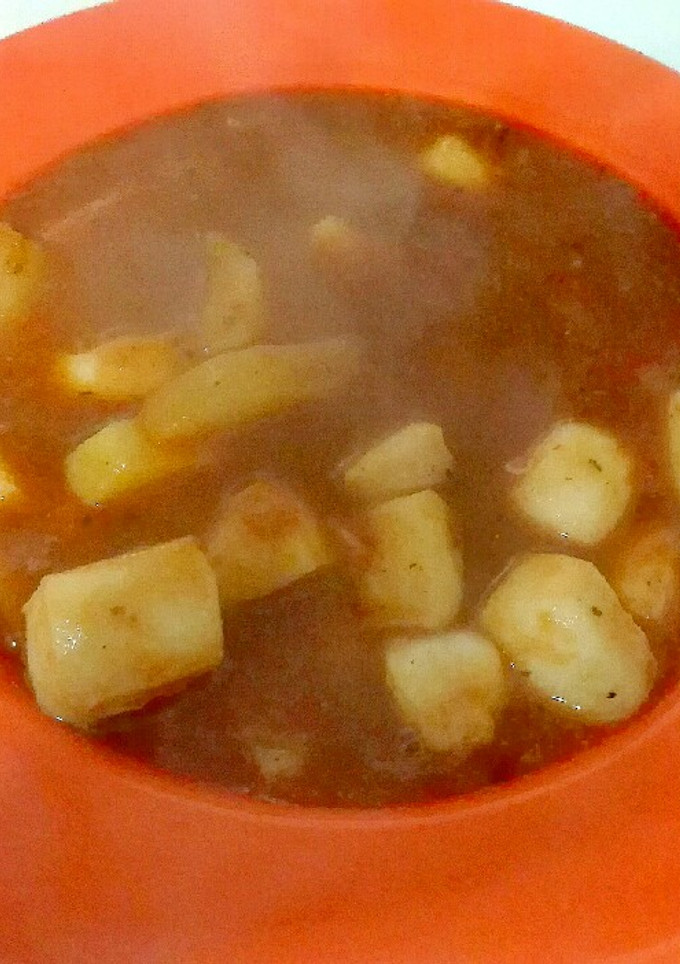 Una foto de Sepia en salsa de caldo de pescado