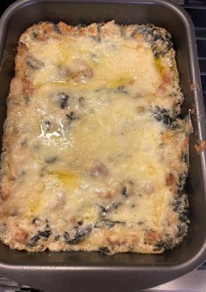 A picture of Two-Layer Lasagna with Tuscan Kale, Sausage, and Melting Fontal Cheese.