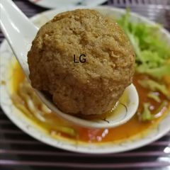 A picture of Tom Yum Soup With Meatball And Dumpling.