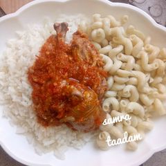 A picture of White rice,macaroni and chicken stew.