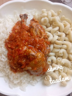 A picture of White rice,macaroni and chicken stew.
