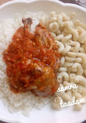 A picture of White rice,macaroni and chicken stew.