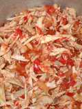 Pollo reciclado con tomate