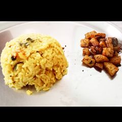 A picture of Dal rice with crispy potato.