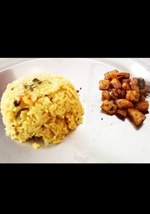 A picture of Dal rice with crispy potato.