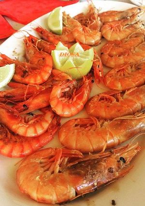 Una foto de Langostinos a la parrilla