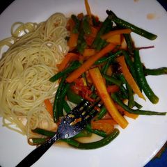 A picture of Spaghetti and stir fried veggies.