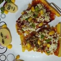 A picture of French fries pizza.