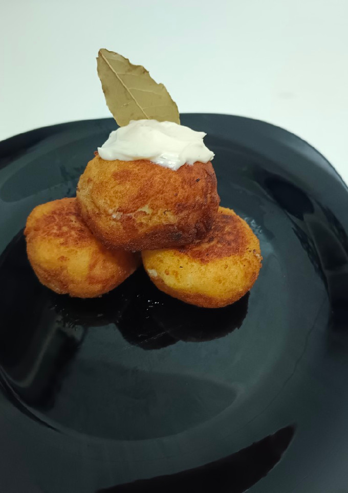 Una foto de Bolas XL de papa y queso