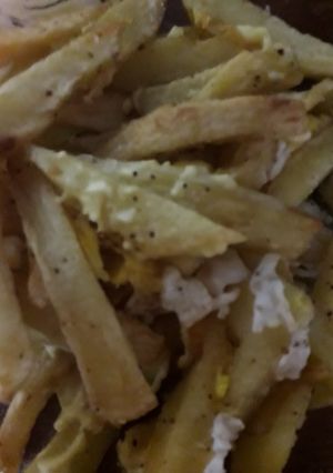 Una foto de Papas fritas con huevo
