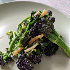 A picture of Japanese style fried purple sprouting broccoli.