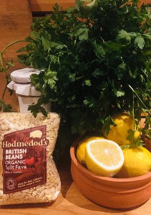 A picture of Hummus with a choice of fresh herb and spice toppings 🌱.