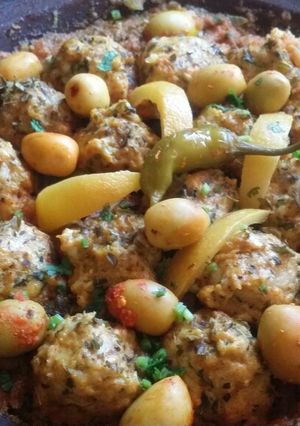 صورة لوصفة طاجين بكويرات سمك الميرلا