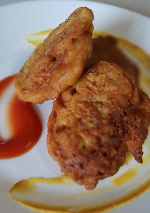 Una foto de Frituras de harina de trigo con pimientos y jamón