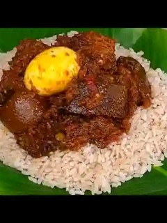 A picture of Ofada Rice and Ayamase (Green Pepper Sauce).