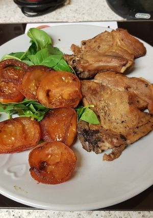 A picture of My Plain Pork Chops with Balsamic Grilled Tomatoes.😁.