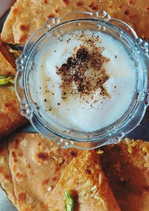 A picture of Gobhi paratha with mitha Dahi.