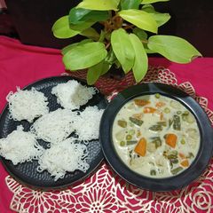 A picture of Idiyappam With Vegetable Curry.