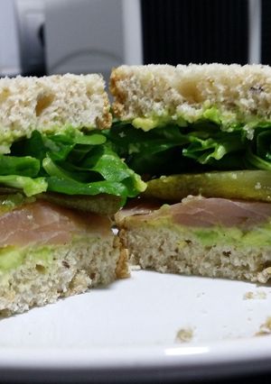 A picture of Avocado, smoked salmon and pickle sandwich.