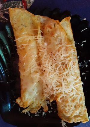 A picture of Zucchini pancakes with cheese.