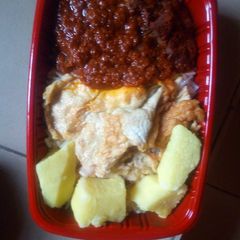 Boiled yam with fried egg and sauce A picture of Boiled yam with fried egg and sauce.