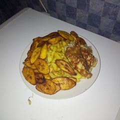 A picture of Chips wit plantain and egg.