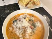 A picture of red pepper tomato soup