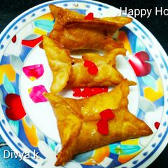 A picture of Momo shaped badam stuffed dry ghujia.