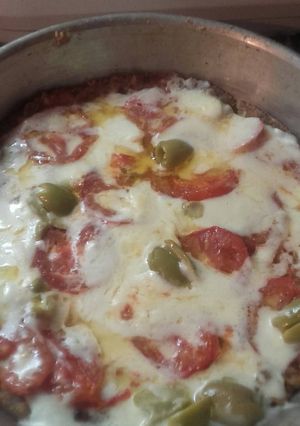 Una foto de Pizza con Reciclado de pan y zanahorias