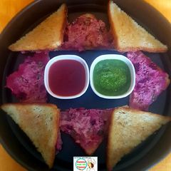 A picture of Sooji Salad Triangular Toast.