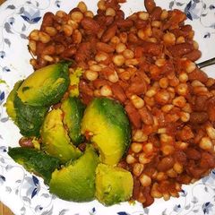 A picture of Githeri served with avocado.
