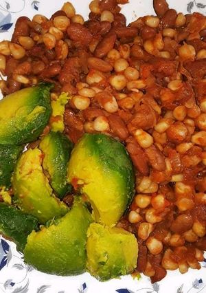 A picture of Githeri served with avocado.