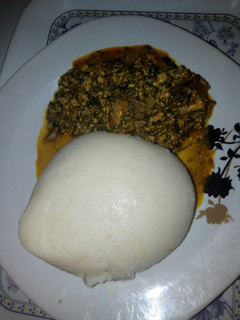 A picture of Egusi soup with semo.