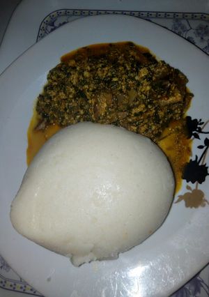 A picture of Egusi soup with semo.