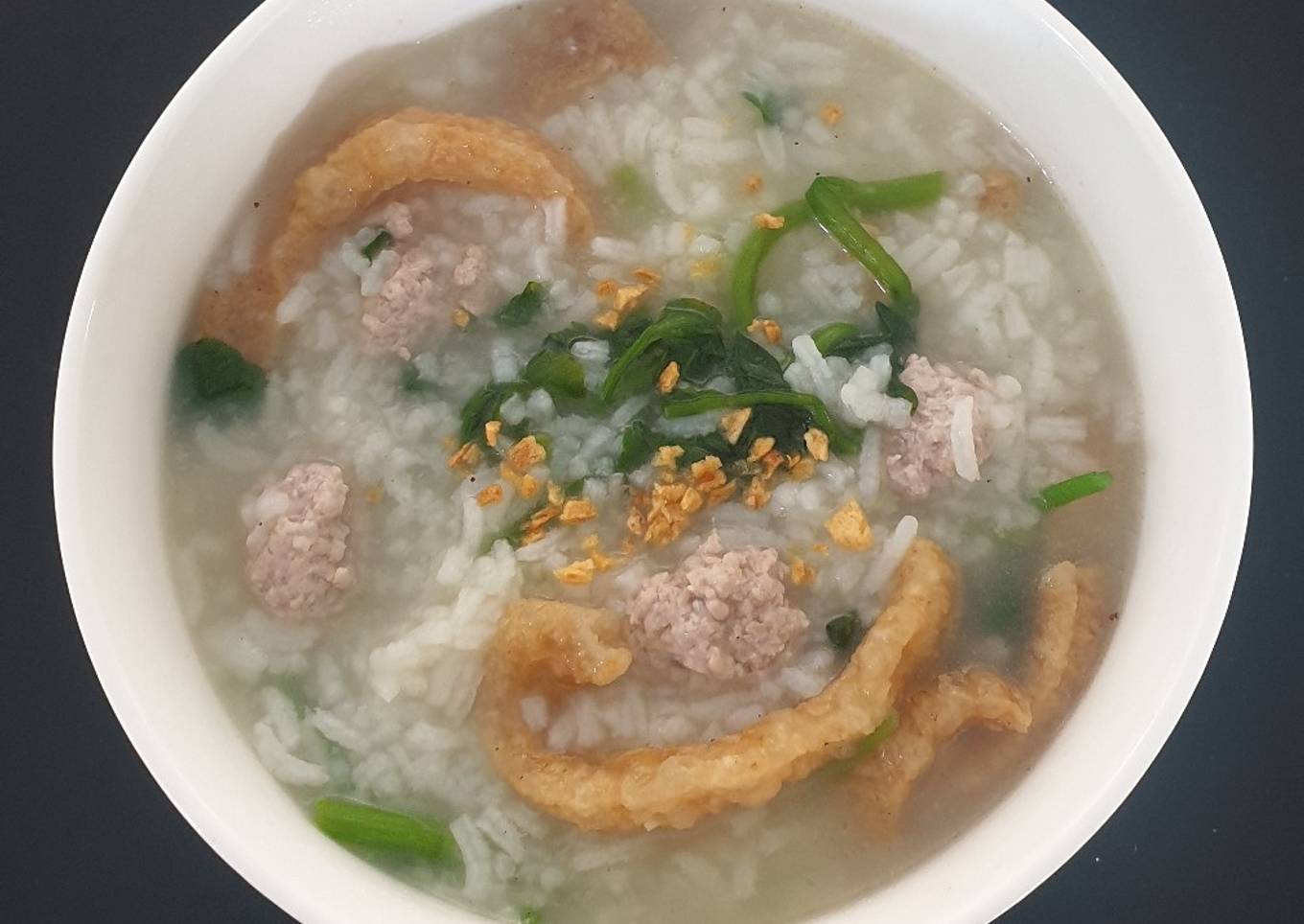 Congee with pork mince and watercress