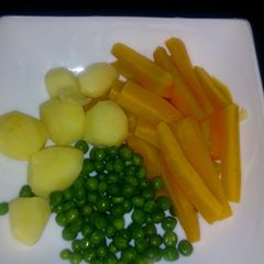 A picture of Boiled potatoes, carrots& peas.