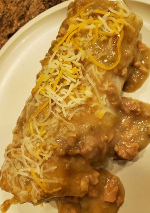 A picture of Smothered Green Chile Steak burritos.