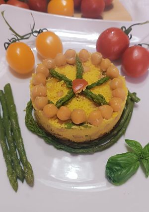 Foto di Cous cous con asparagi,ceci e pomodorini al profumo di zafferano