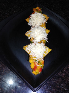 A picture of Raw Mango Nachos with Ripe Mango Salsa.