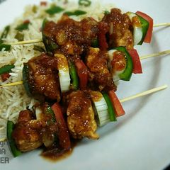 A picture of Shashlik with sweet and sour sauce.