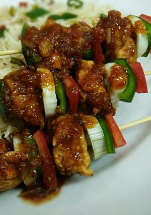A picture of Shashlik with sweet and sour sauce.